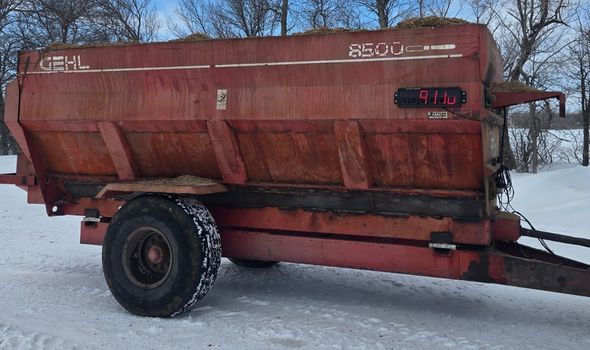 LED scoreboard display on the side of a grain cart